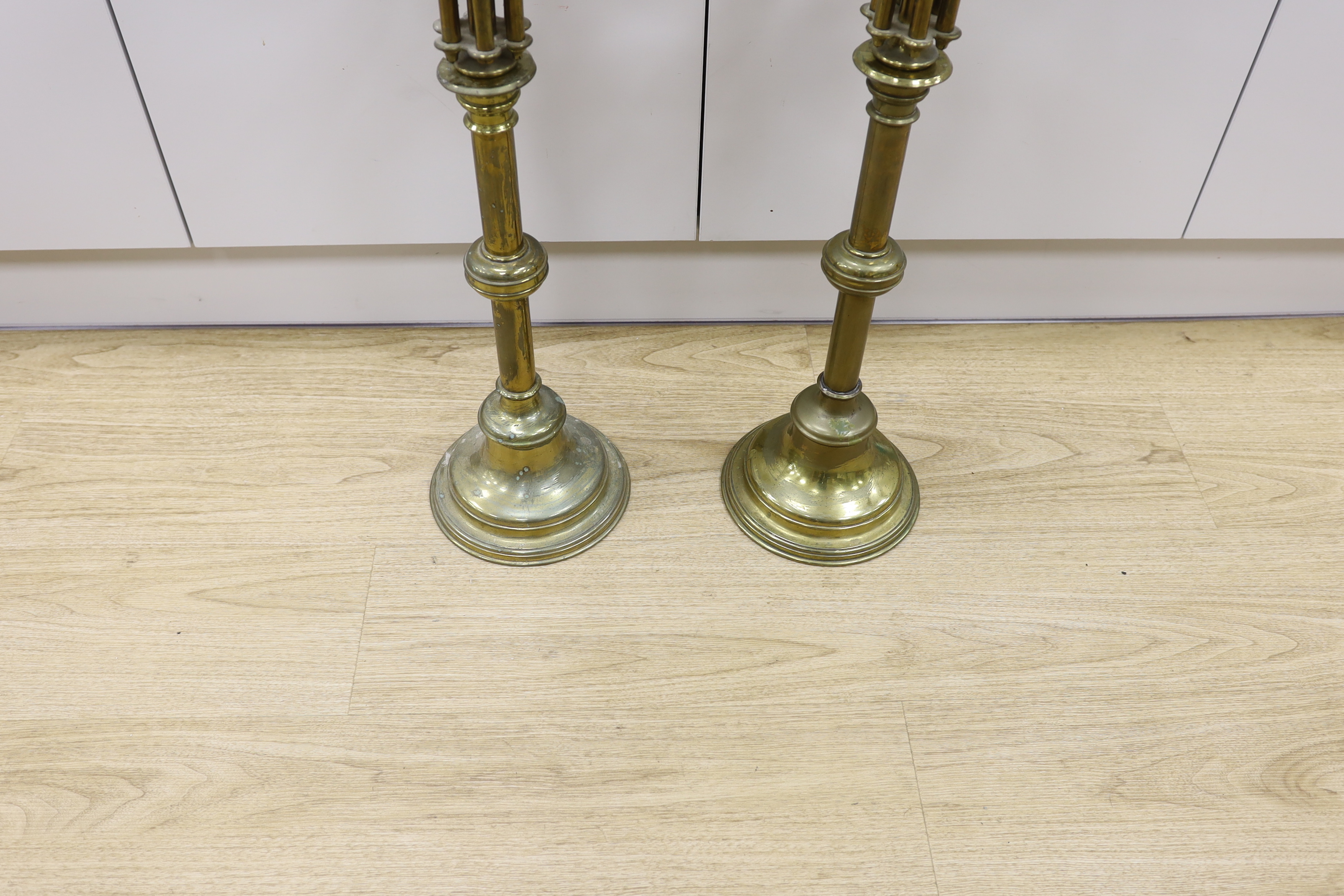 A pair of French brass altar six branch candelabra, 82cm high